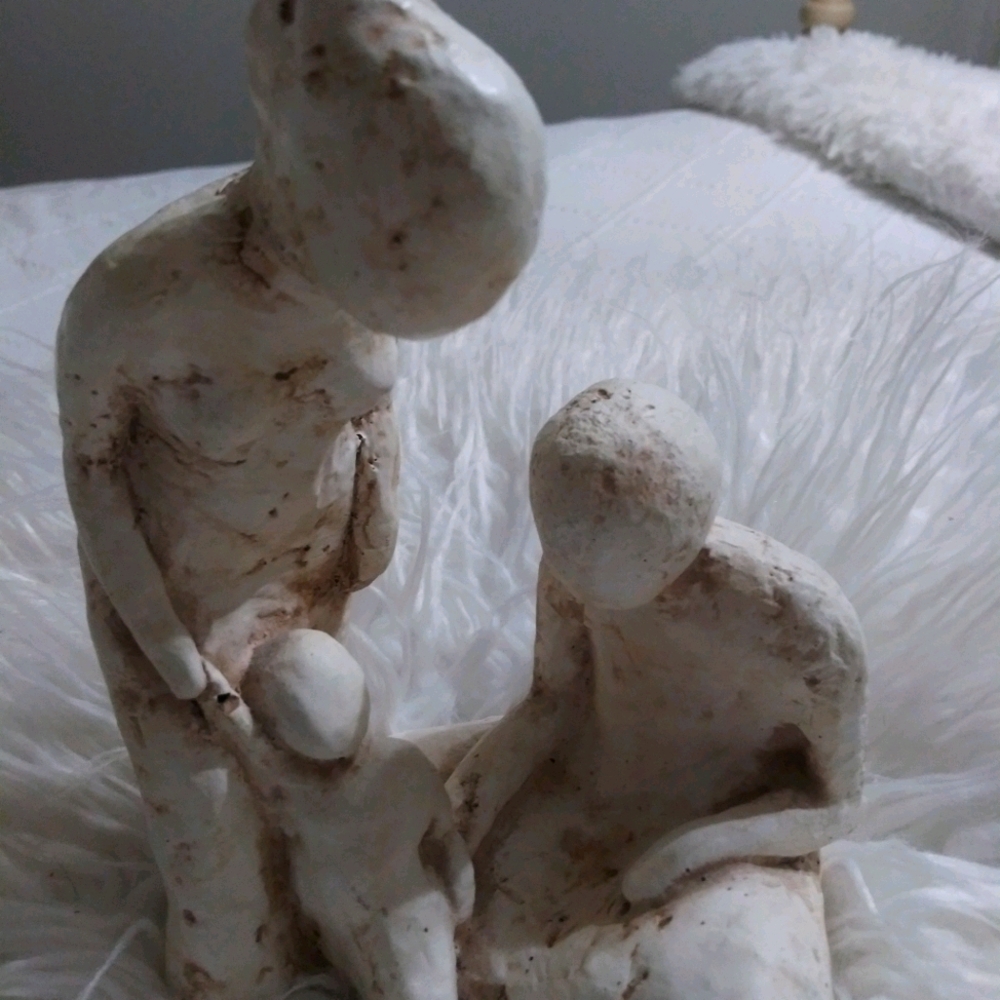 Sculpture of mom dad baby